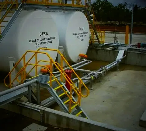 Steel stairs and walkways fabricated by GH Fabrications on fuel tanks